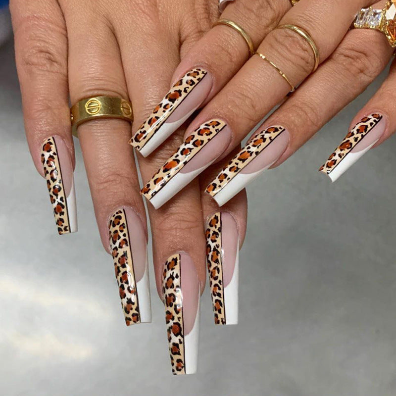 Artful nail extensions in modern leopard design Stornfield