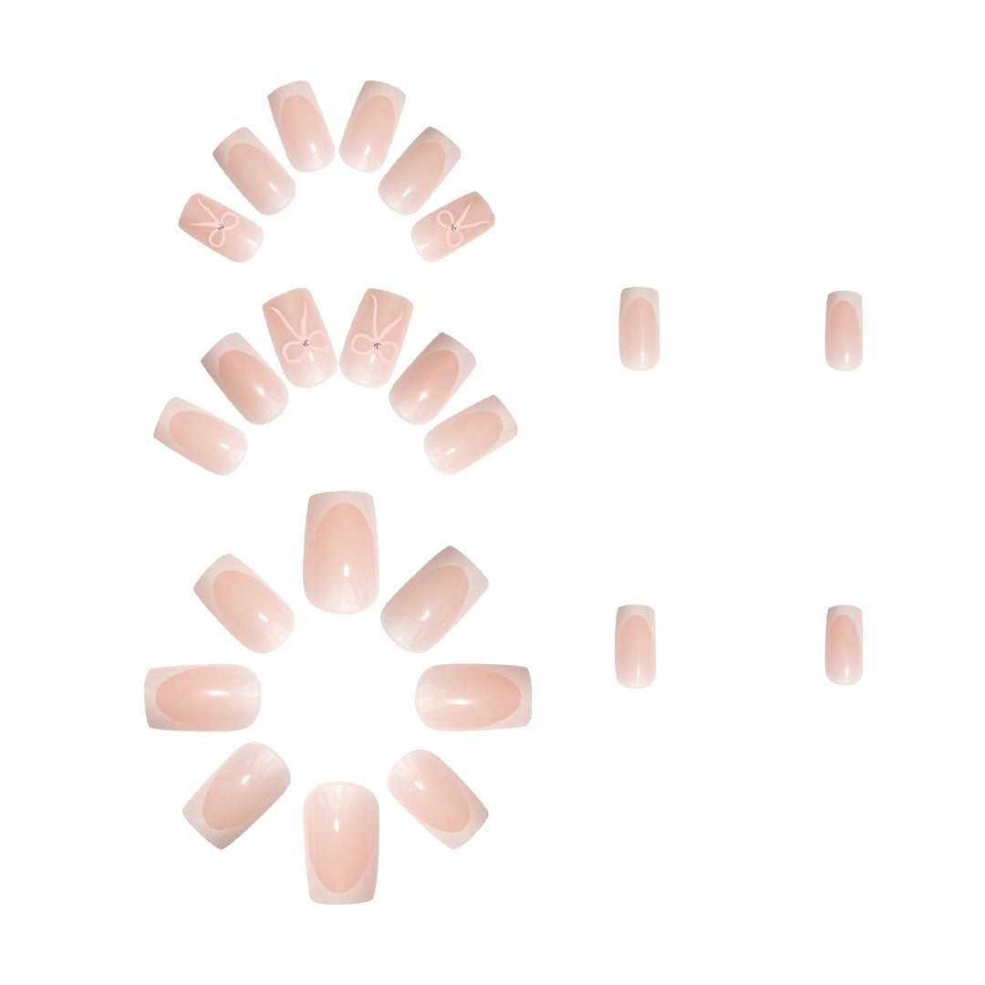 Nail art set with elegant bow and glitter accents Stornfield