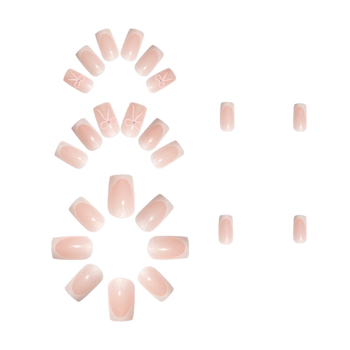 Nail art set with elegant bow and glitter accents Stornfield