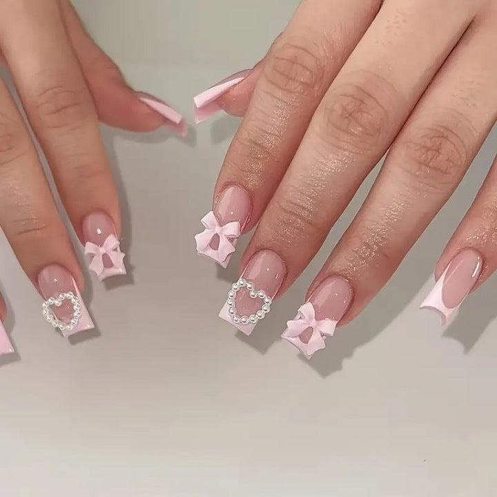 Artificial nail set with 3D bows and pearl accents Stornfield