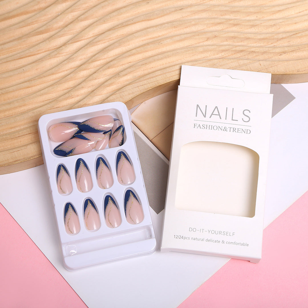 Artistic Nail Design with Elegant Golden Accents Stornfield