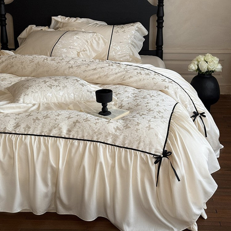 Jacquard bedding set with ruffle, decorative ribbons and fine piping