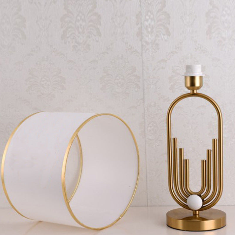 Artistic Table Lamp with Gold and Cream Features