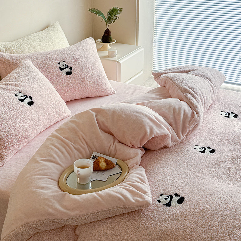 Cozy sherpa bedding set with embroidered penguin motifs and reversible function
