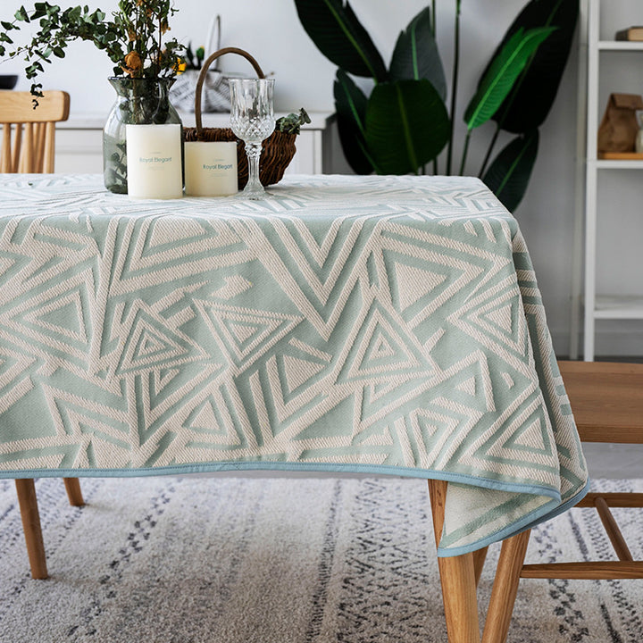 Woven jacquard tablecloth with geometric triangle pattern and easy-care cotton blend