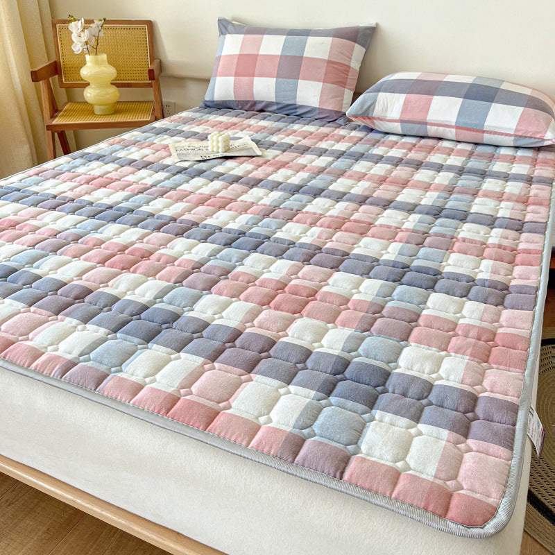 Padded mattress protector-topper with quilting and non-slip underside