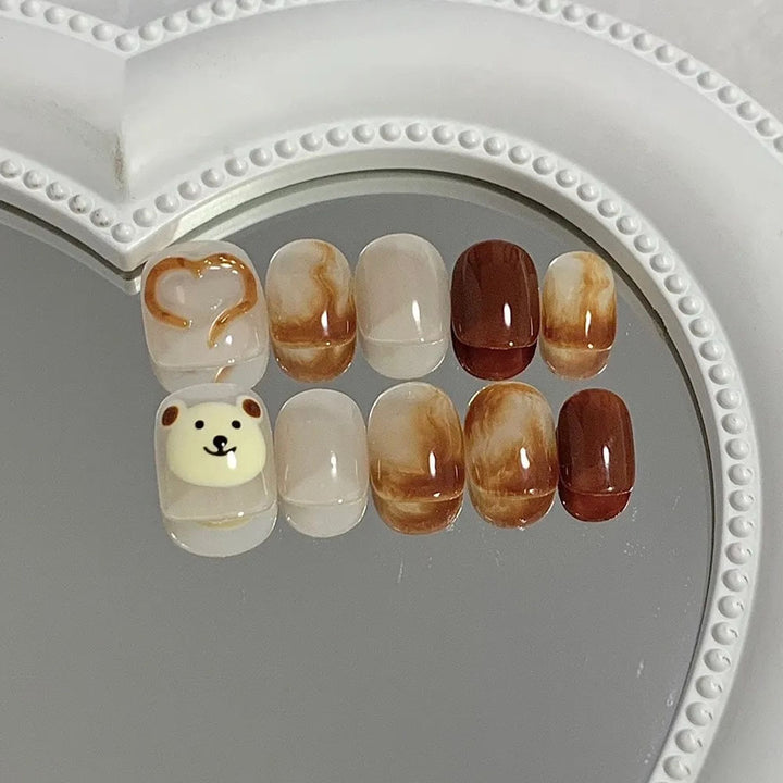 Artificial nails with cute bear design and marbled pattern Stornfield