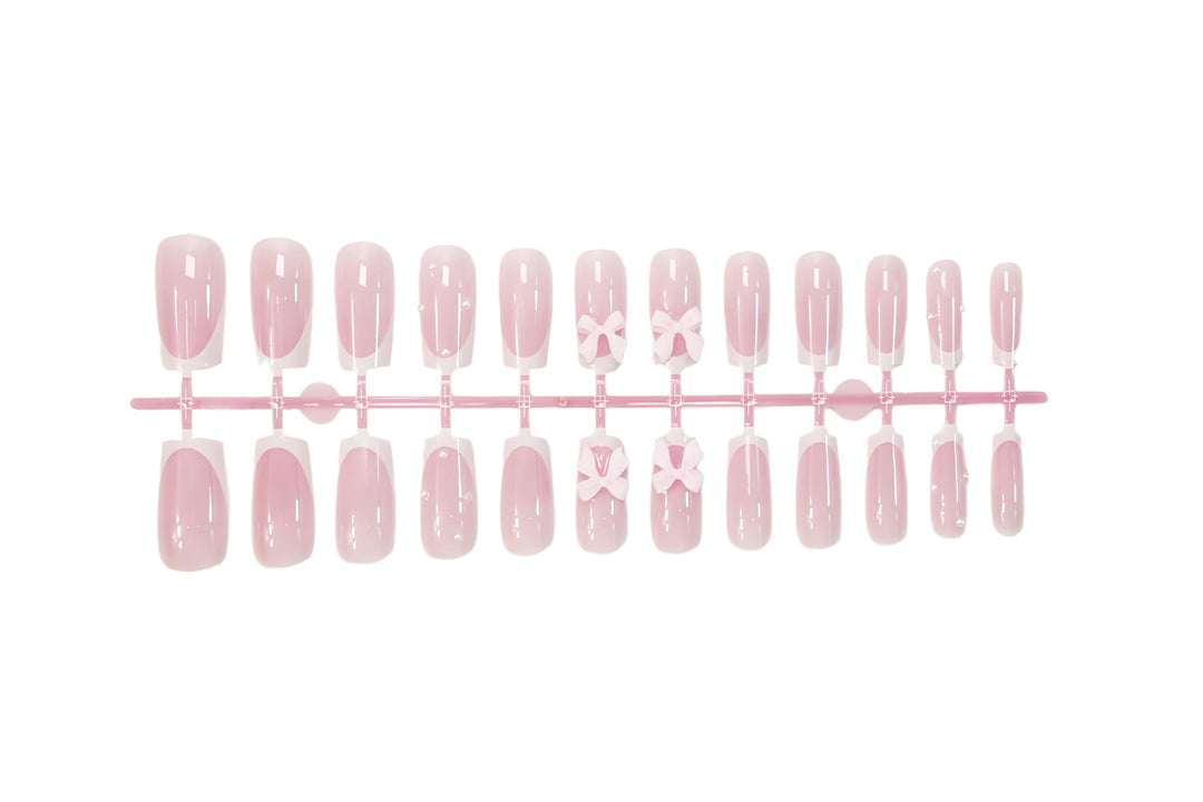 Glamorous artificial nail set with elegant bows and glitter accents Stornfield