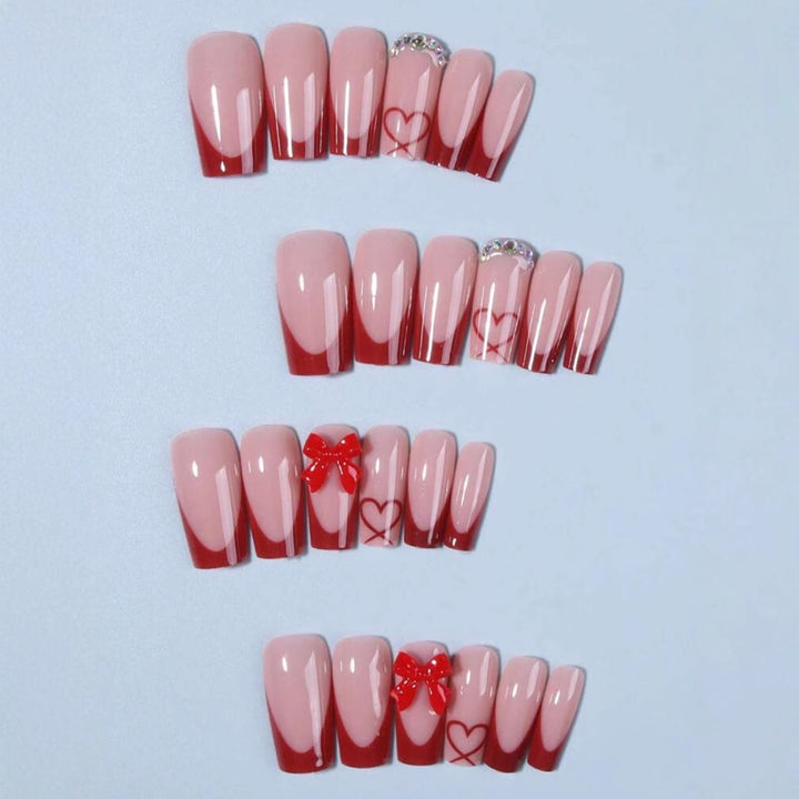 Nail art with heart and bow motifs Stornfield