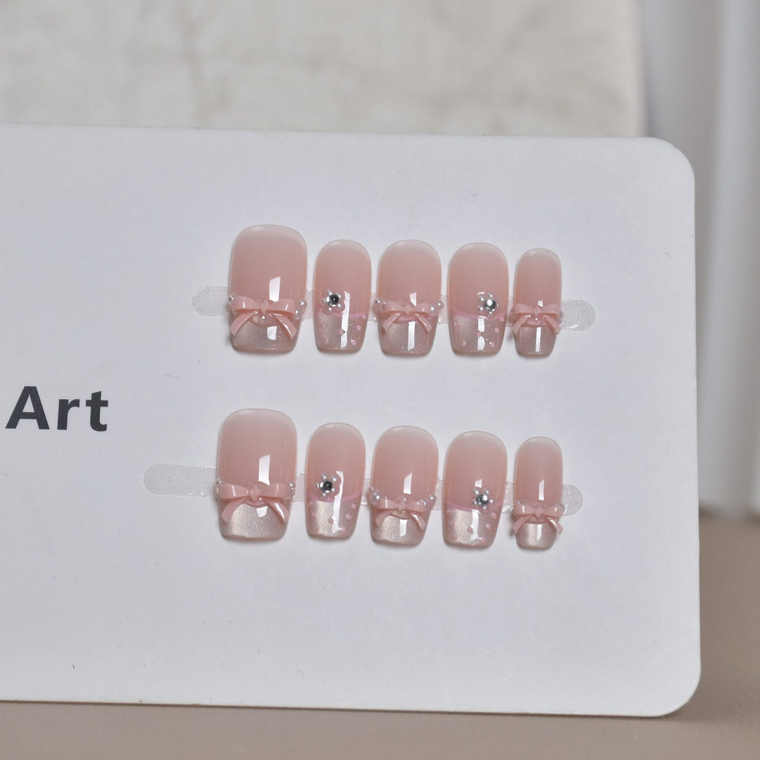 Elegant French Tip Press-On Nail Art with Bow Accents Stornfield