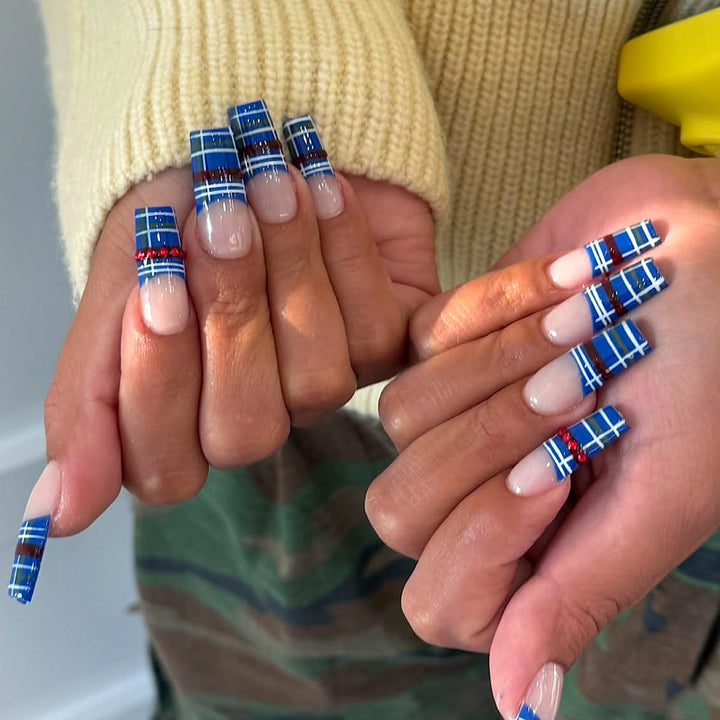 Artificial nails with plaid pattern and glitter stones Stornfield