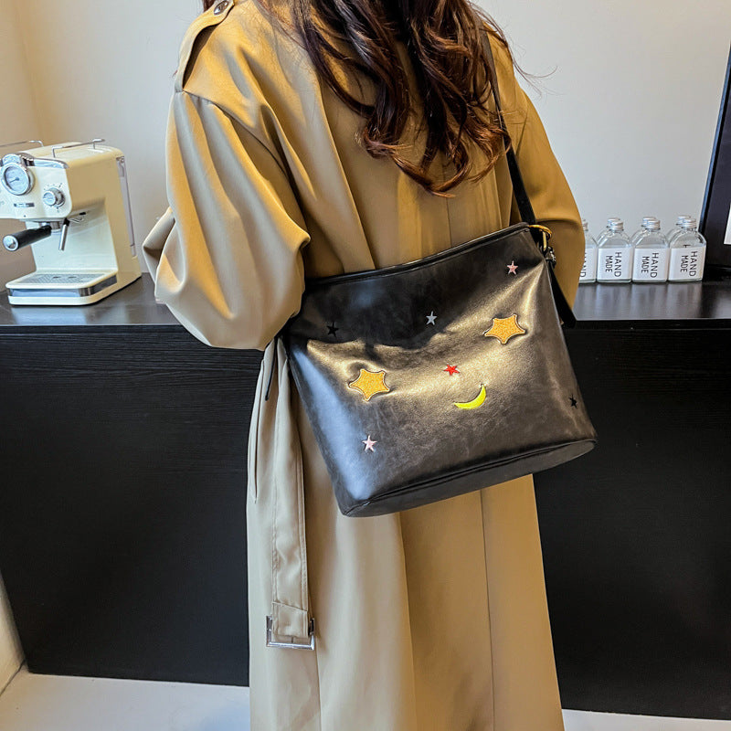 Shoulder bag with charming applications Stornfield
