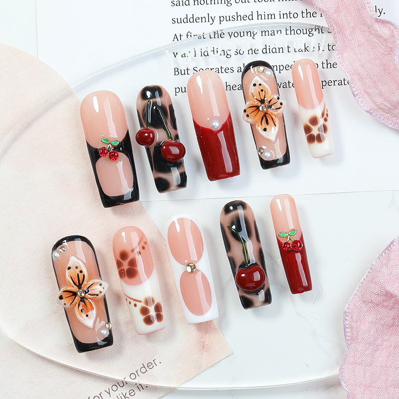 Creative nail art set with floral and fruity accents Stornfield