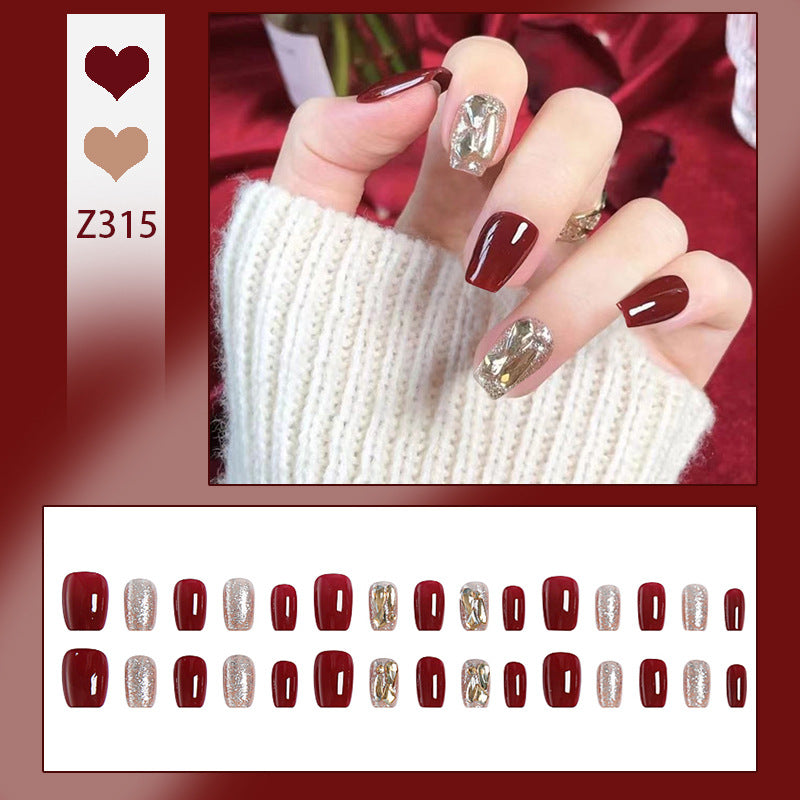 Artificial nail set with elegant glitter and metallic accents Stornfield
