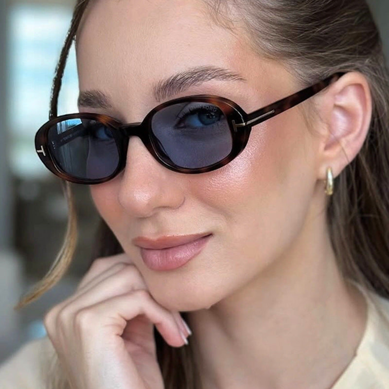Ladies stylish oval sunglasses with golden details Stornfield