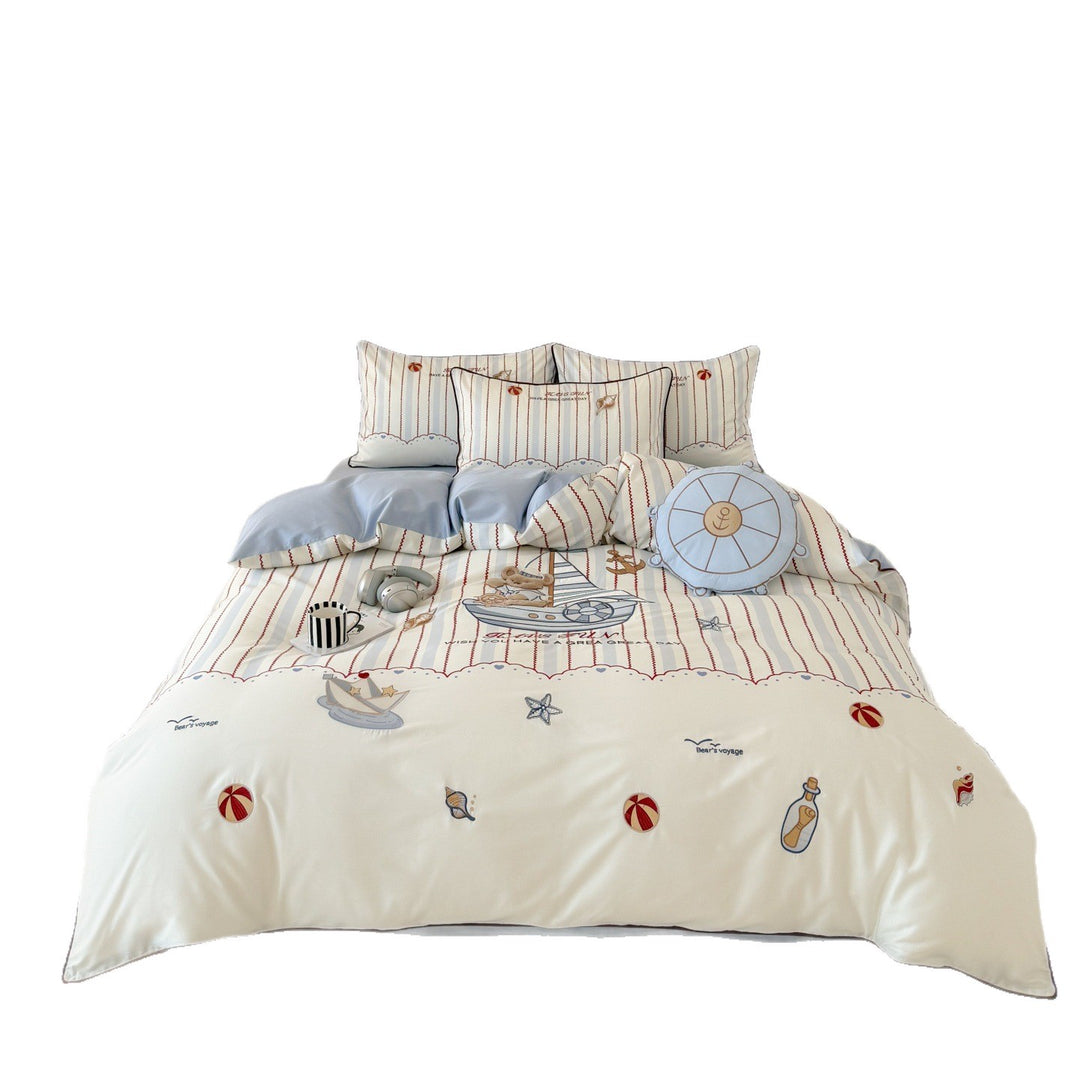 Children's bedding set with embroidered comic design and striped details