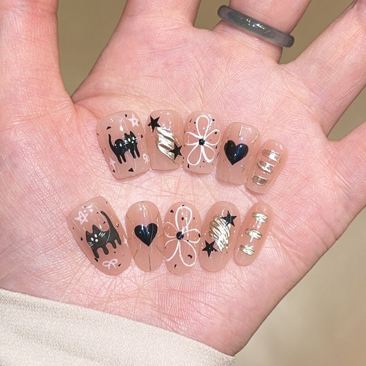 Artificial nails with unique cat and star design Stornfield
