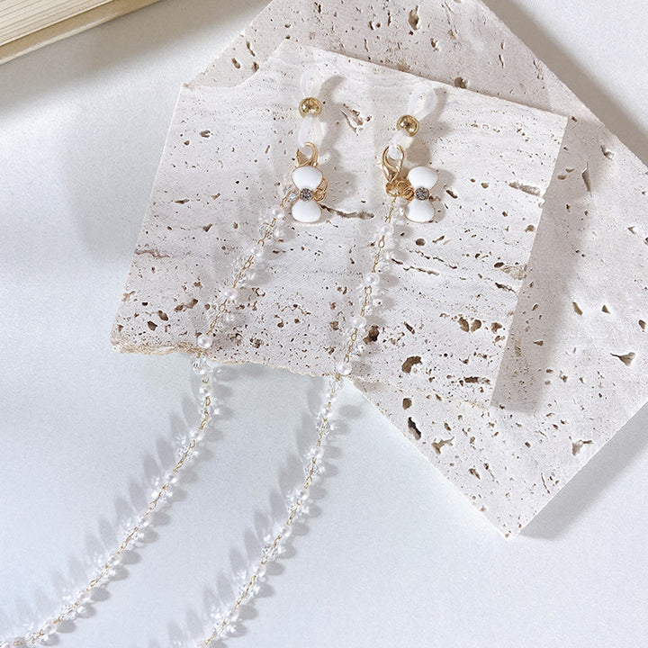 Elegant earrings with pearls and flower pendants Stornfield