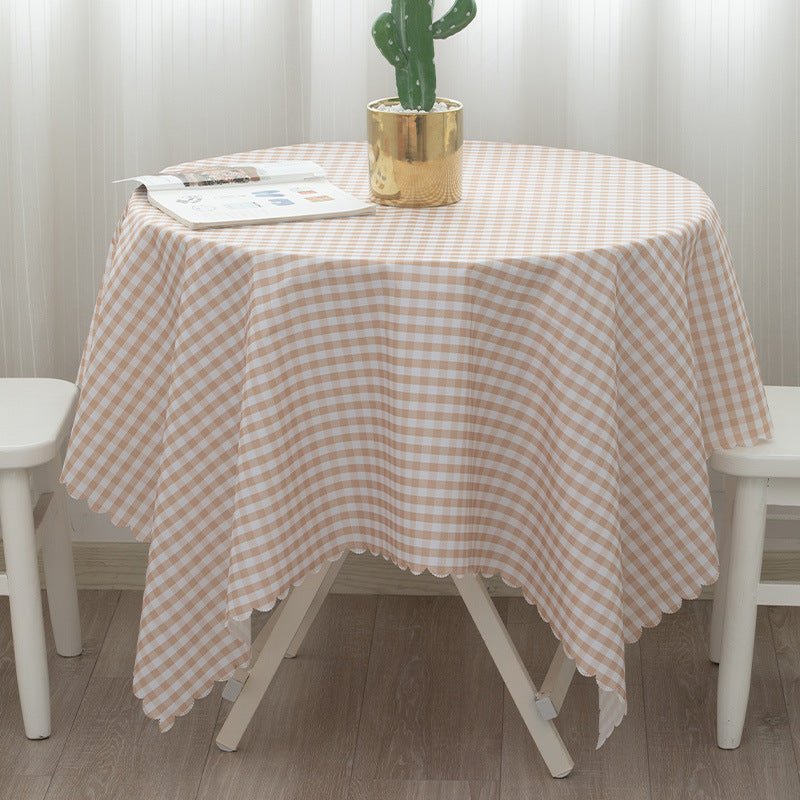 Round washable tablecloth with fine checkered grid pattern and wavy hem