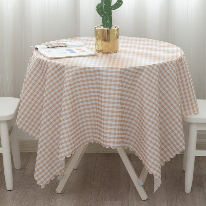 Round washable tablecloth with fine checkered grid pattern and wavy hem