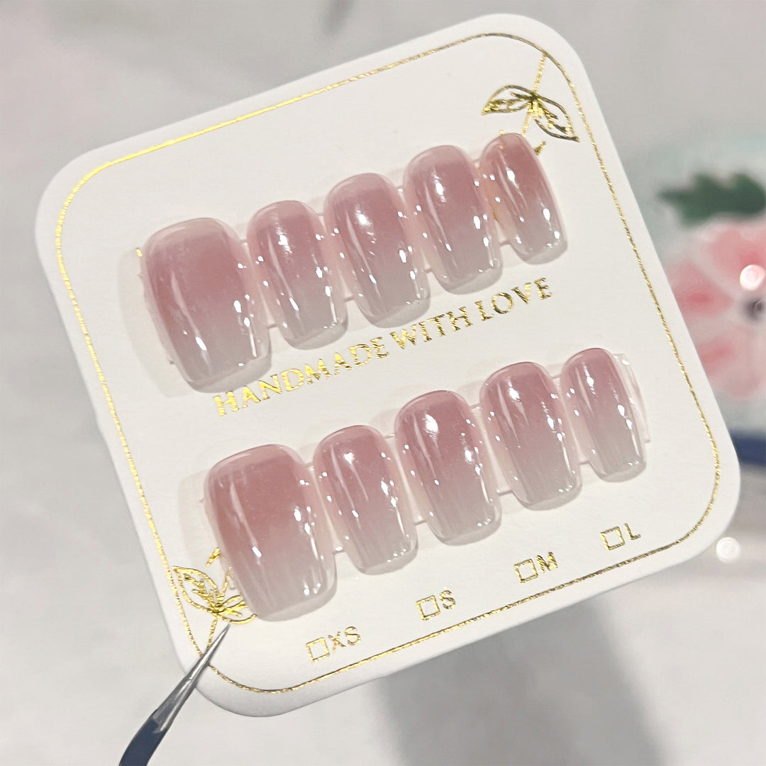 Artificial nail extensions in elegant ombre design Stornfield