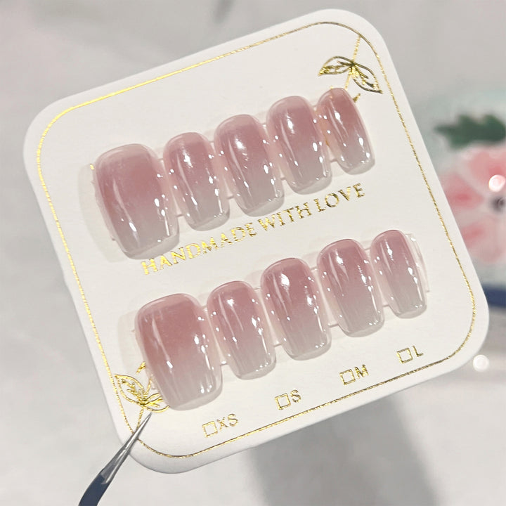 Artificial nail extensions in elegant ombre design Stornfield