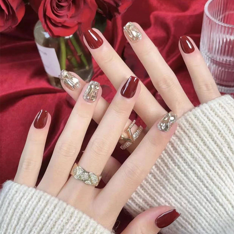 Artificial nail set with elegant glitter and metallic accents Stornfield