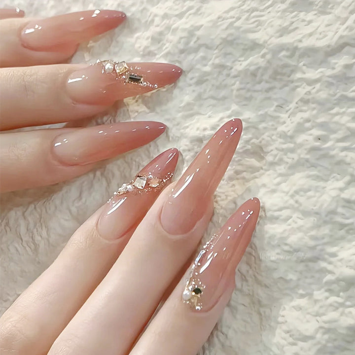 Artificial nail set with elegant ombre effect and glamorous embellishments Stornfield