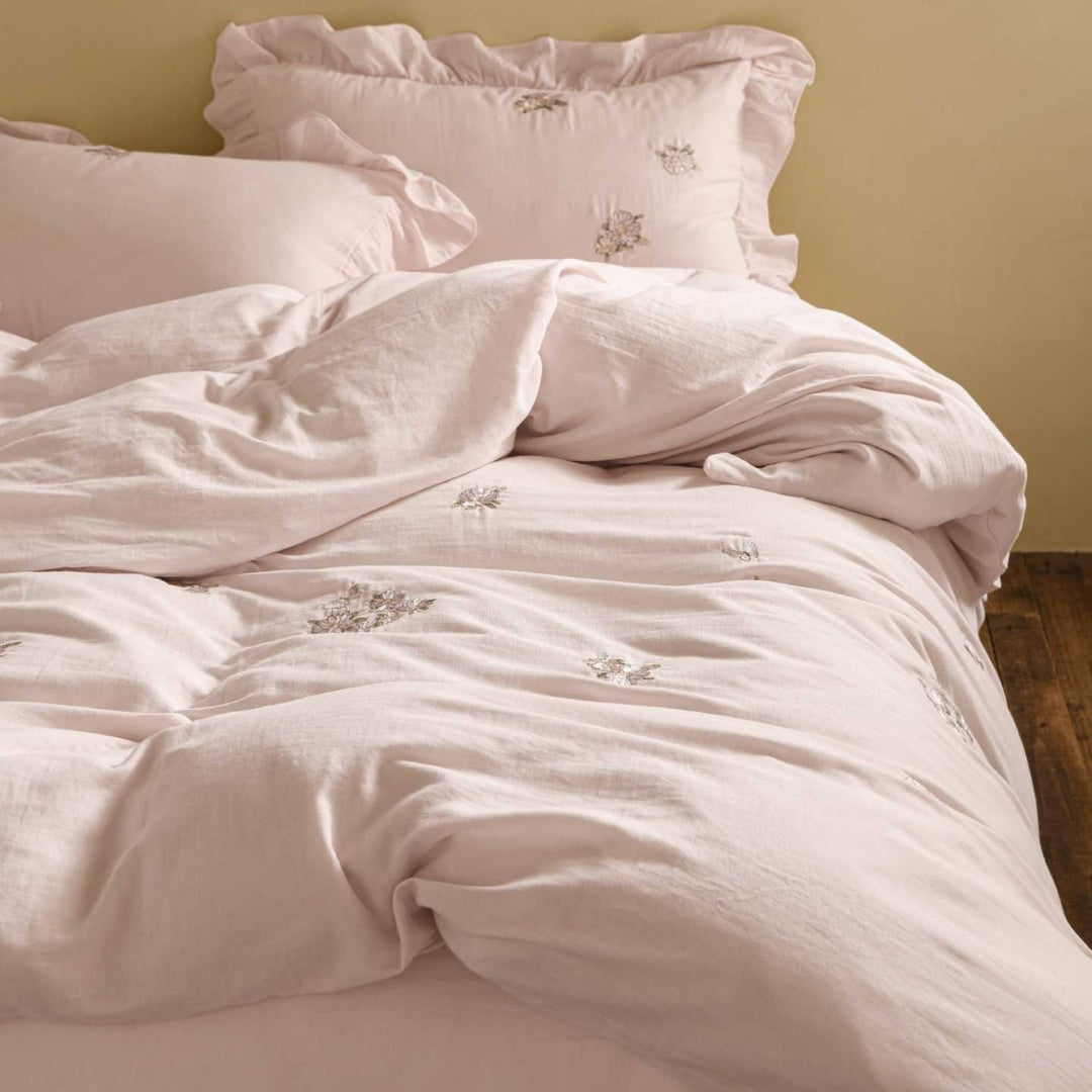Breathable cotton bedding set with delicate flower embroidery and tie ribbon pillow