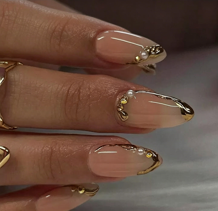 Elegant Gold-Decorated Acrylic Nail Art Enhancements Stornfield