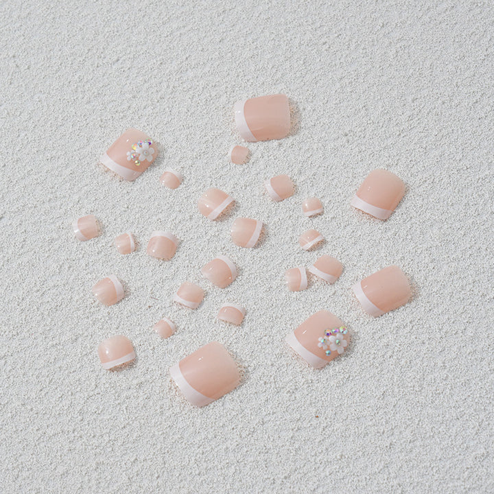 Artificial nail set with elegant French tip design and sparkling accents Stornfield