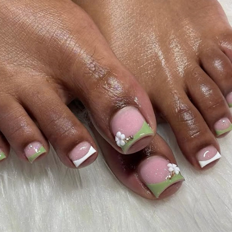 Nail art set with delicate flower designs and glossy finish Stornfield