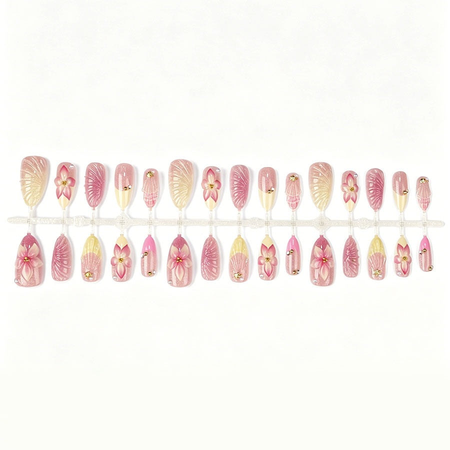 Artificial nail set with elaborate flower and shell patterns Stornfield