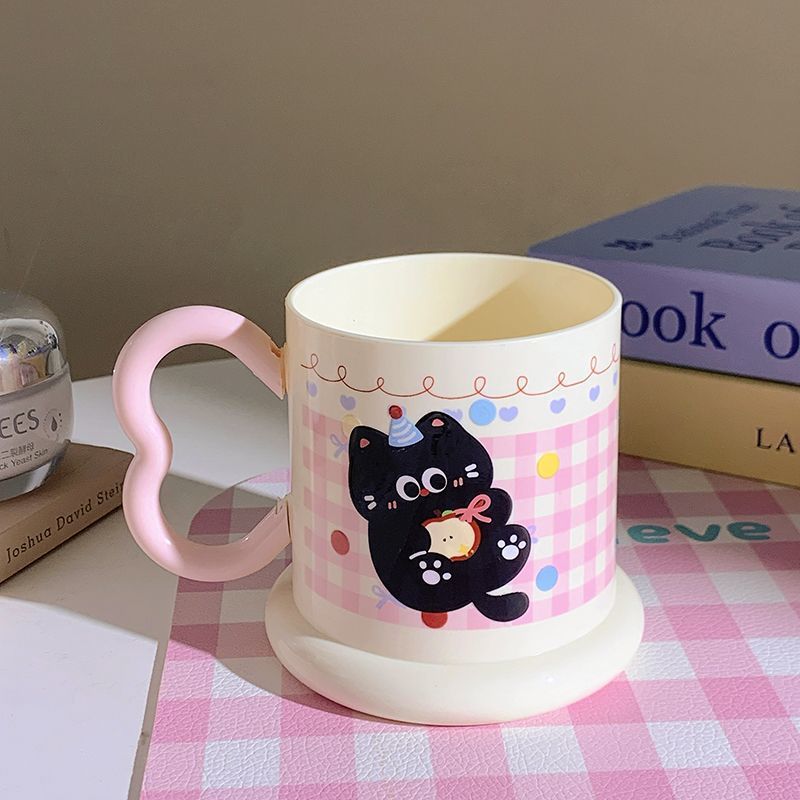Ceramic mug with playful cat motif Stornfield