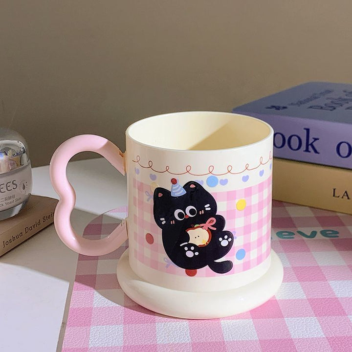 Ceramic mug with playful cat motif Stornfield