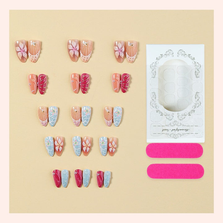Artificial nail set with floral 3D design and glitter accents Stornfield