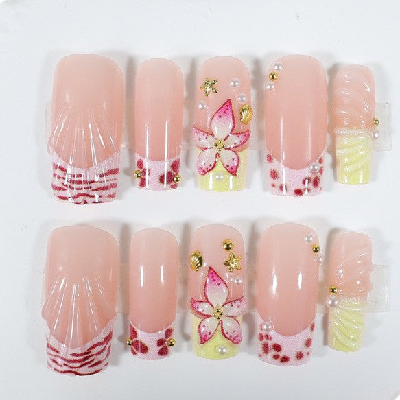 Nail art set with floral accents and glitter decorations Stornfield