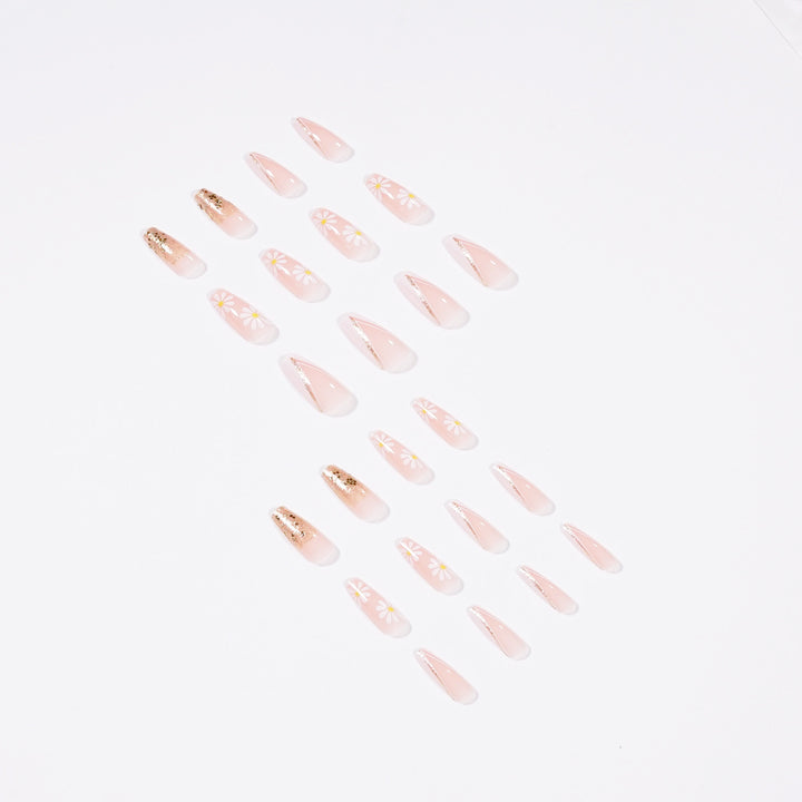 Artful nail extensions with floral designs and glitter accents Stornfield