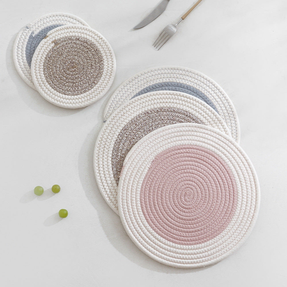 Round handwoven table placemat made of cotton yarn with structured spiral binding