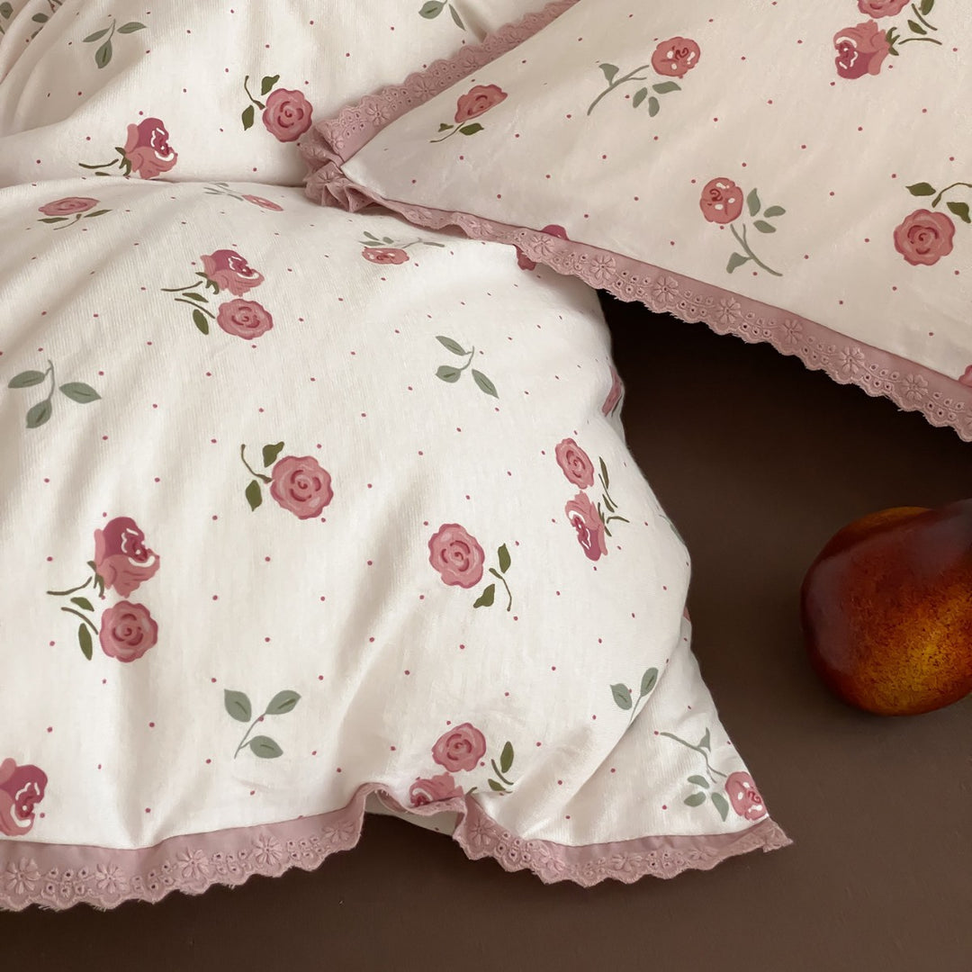 Finely woven cotton percale bedding set with delicate floral print and crocheted lace edge