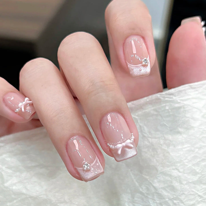 Elegant French Tip Press-On Nail Art with Bow Accents Stornfield