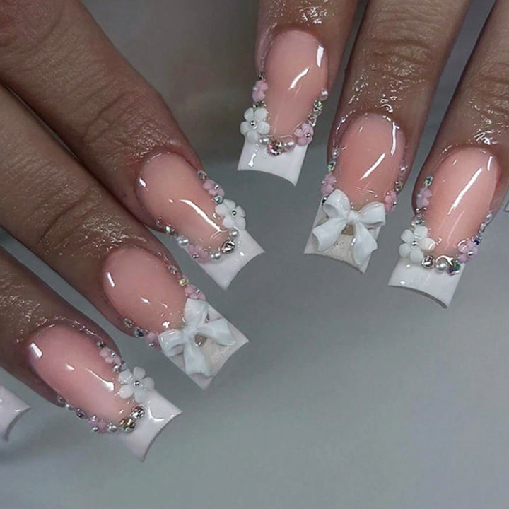 Acrylic Nail Set with Elegant Bows and Glitter Accents Stornfield