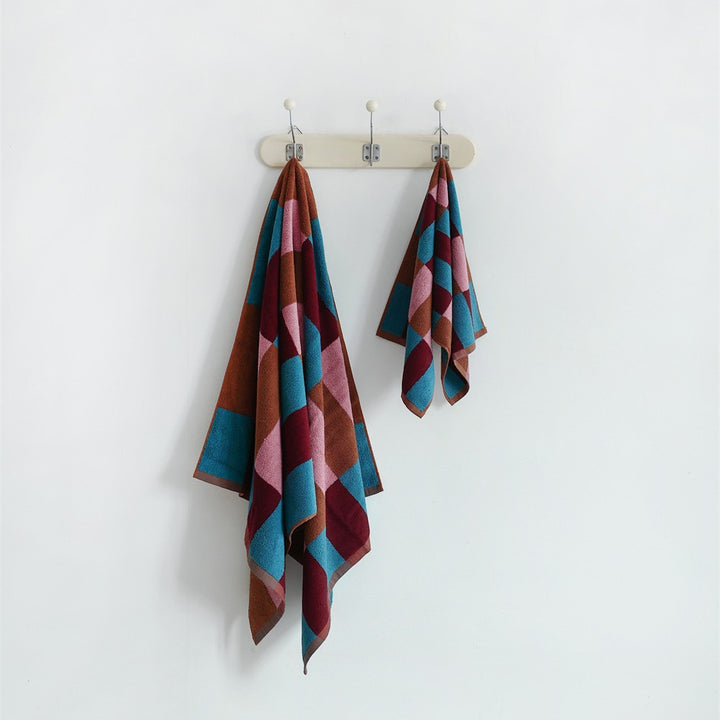 Soft terry hand and bath towel set made of cotton with geometric check pattern