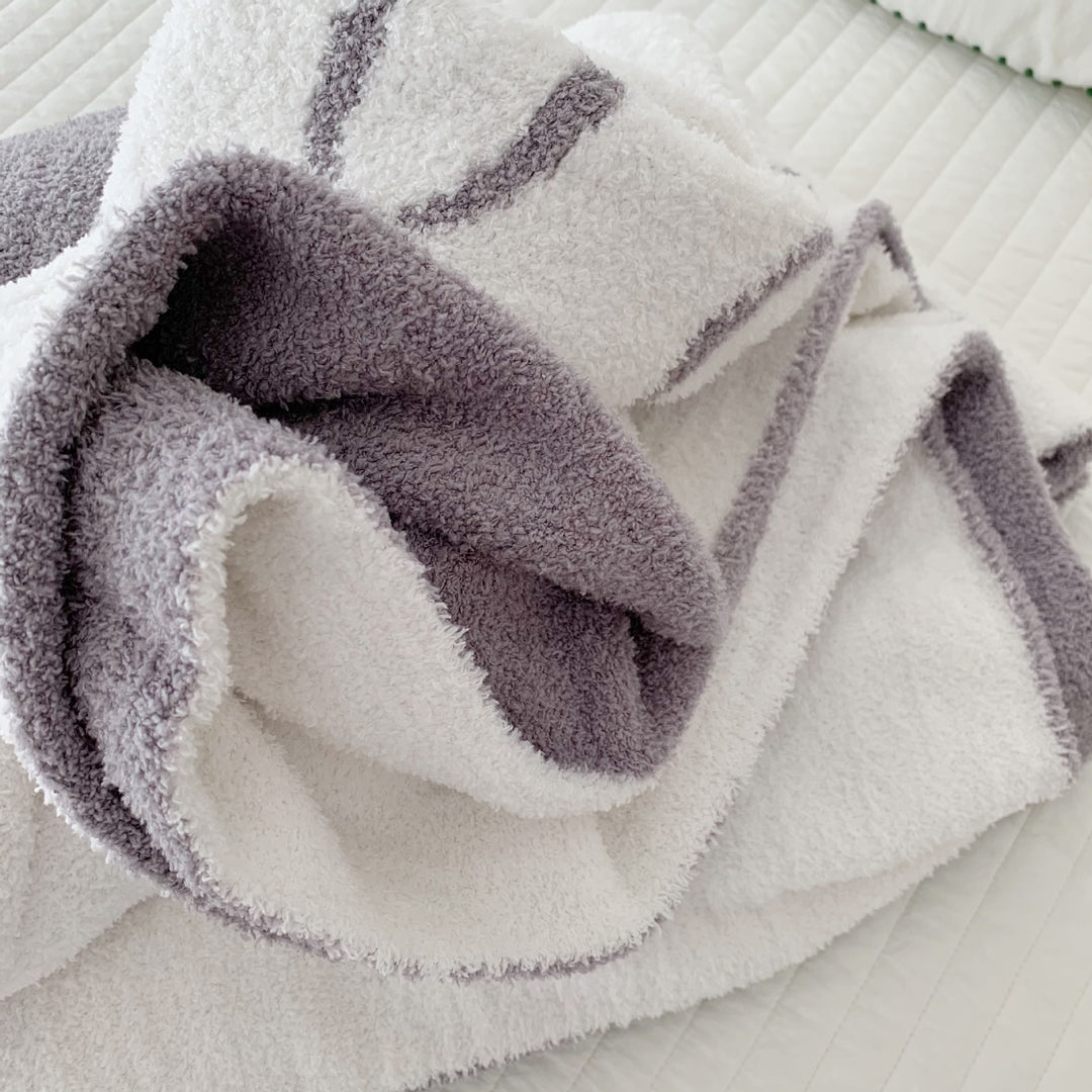 Cozy bedspread made of microfiber with a large woven cartoon motif