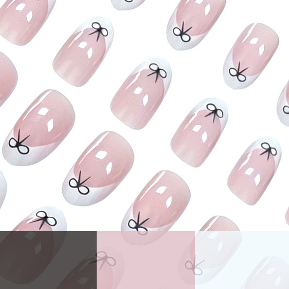 Artistic Bow-Embellished Nail Art Stornfield