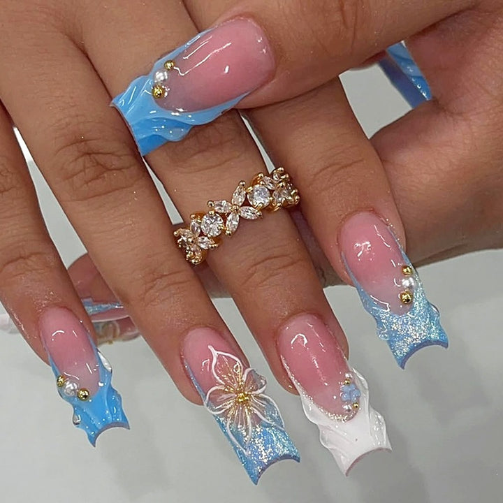 Nail set with elegant floral accents and glitter Stornfield