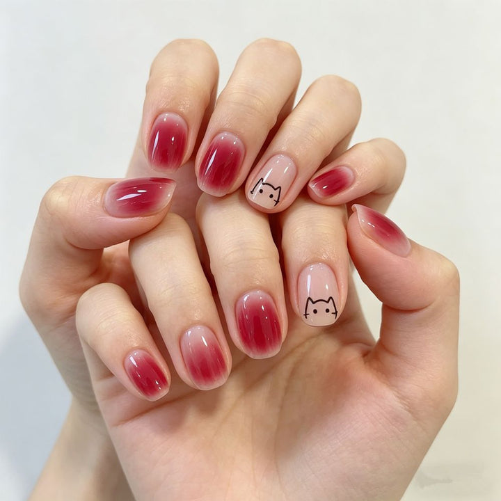 Artificial nails with elegant ombre effect and playful cat design Stornfield