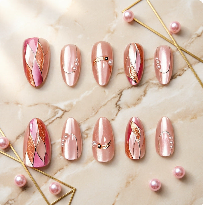 Artificial nails with elegant pearl and gold accents Stornfield
