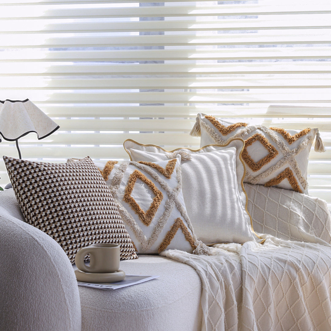 Square cushion cover made of cotton-linen with raised diamond tufting and corner tassels Stornfield