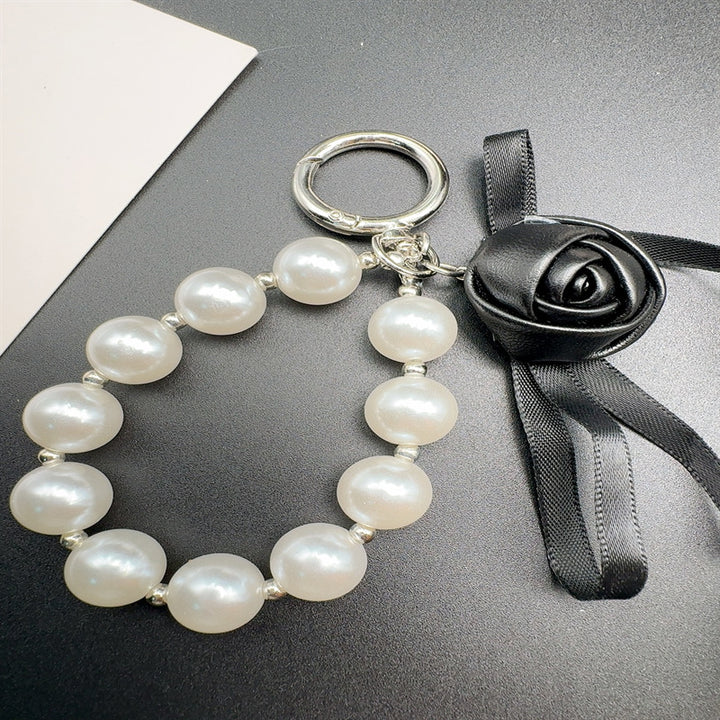 Elegant Pearl and Leather Charm Keychain Stornfield